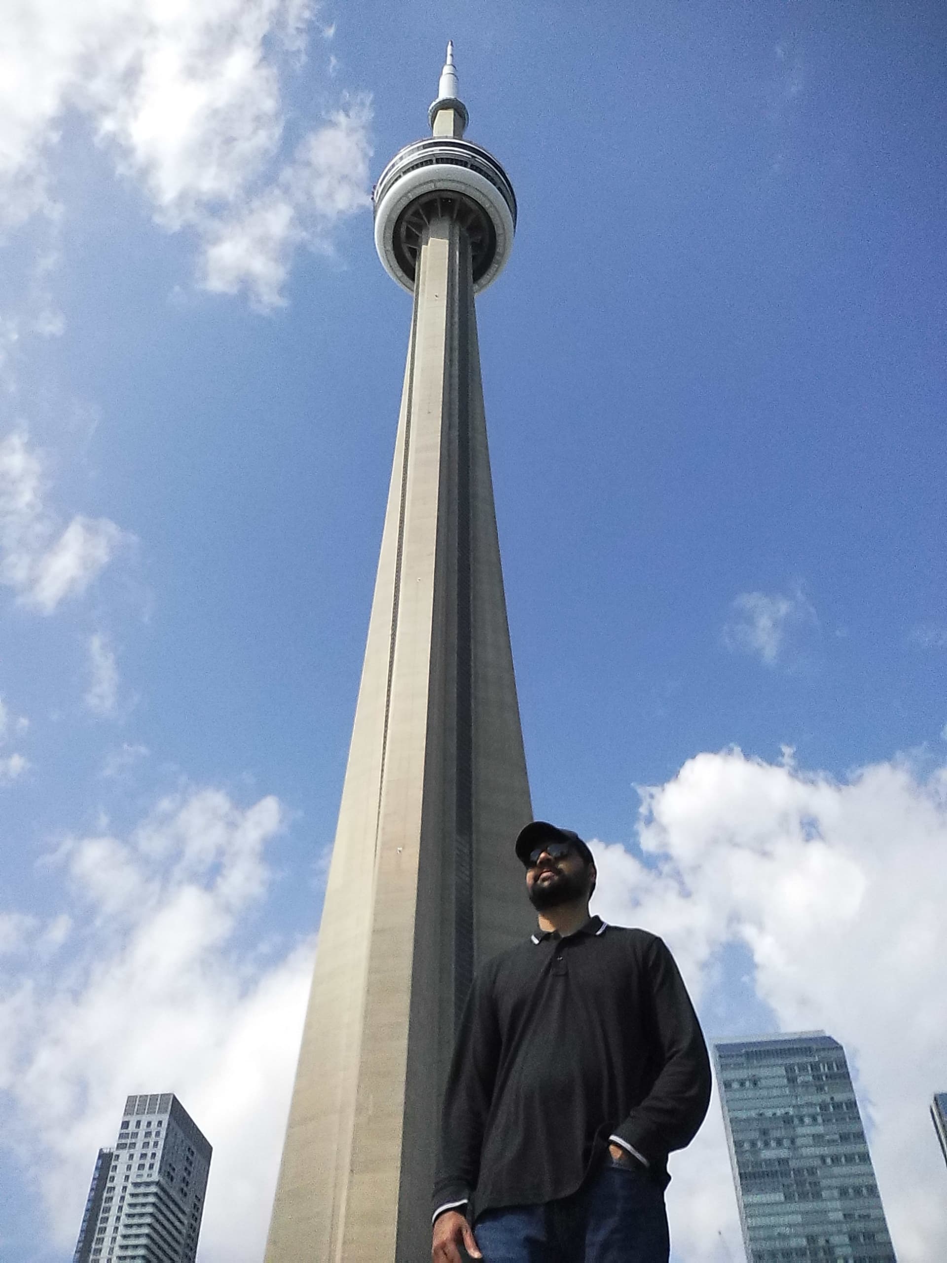 Shoaib Malick outside the CN Tower in Toronto